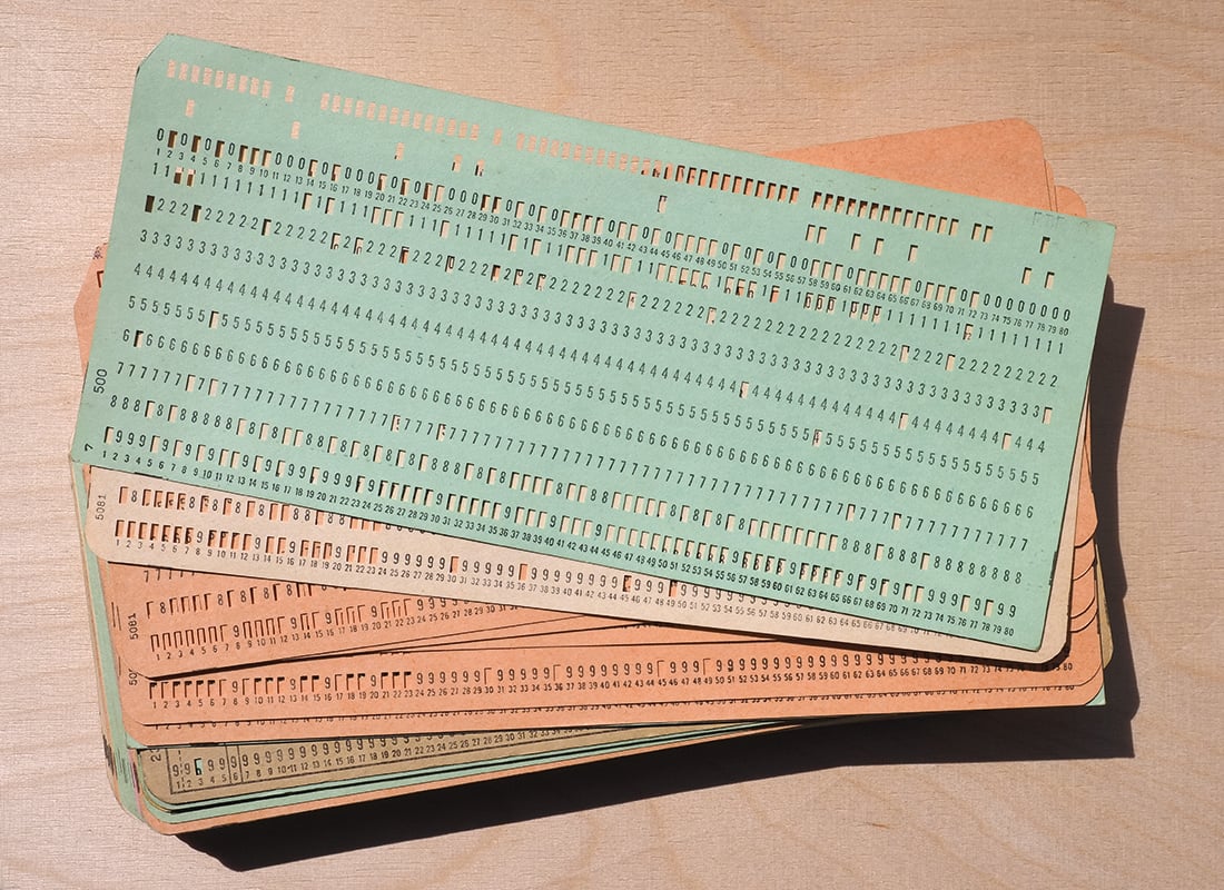 What were punch cards and how did they change business?