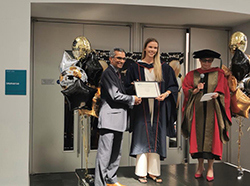 Mohamed Altaf, Chair of BCS, Chartered Institute for IT (London West Branch) presenting a prize for the best final year project to Gabija Mikulyte of Brunel University on Conversational Agents and Loneliness Impact of Agent Personality on Users’ Experience and Sense of Loneliness